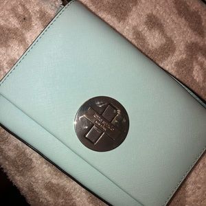 Small, light blue Kate Spade crossbody purse